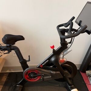 Peloton Black and Red Exercise Bike with Screen